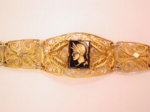 Heavy Filigree Goldtone Bracelet Featuring an Intaglio Soldier