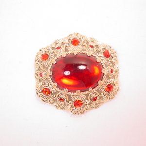 German Aluminum Filigree and Red Rhinestone Pin
