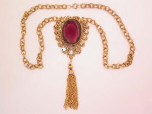 Giant Curlicue Design and Purple Rhinestone Necklace
