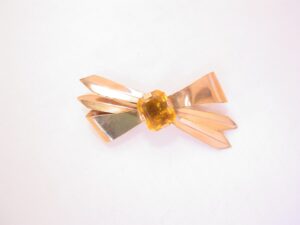 Simple Topaz and Goldtone Bow Pin