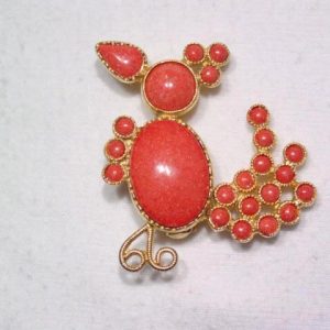 Coral Colored Goony Bird Pin with Tremblant Tail
