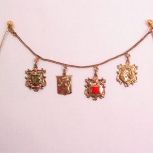 Double Stickpins with 4 Shields on a Chain